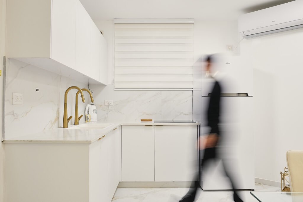 A man walking in the kitchen , interior design photography 