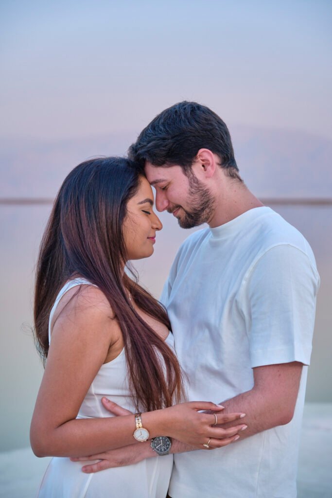 Couples portrait photography, loving couple by the sea